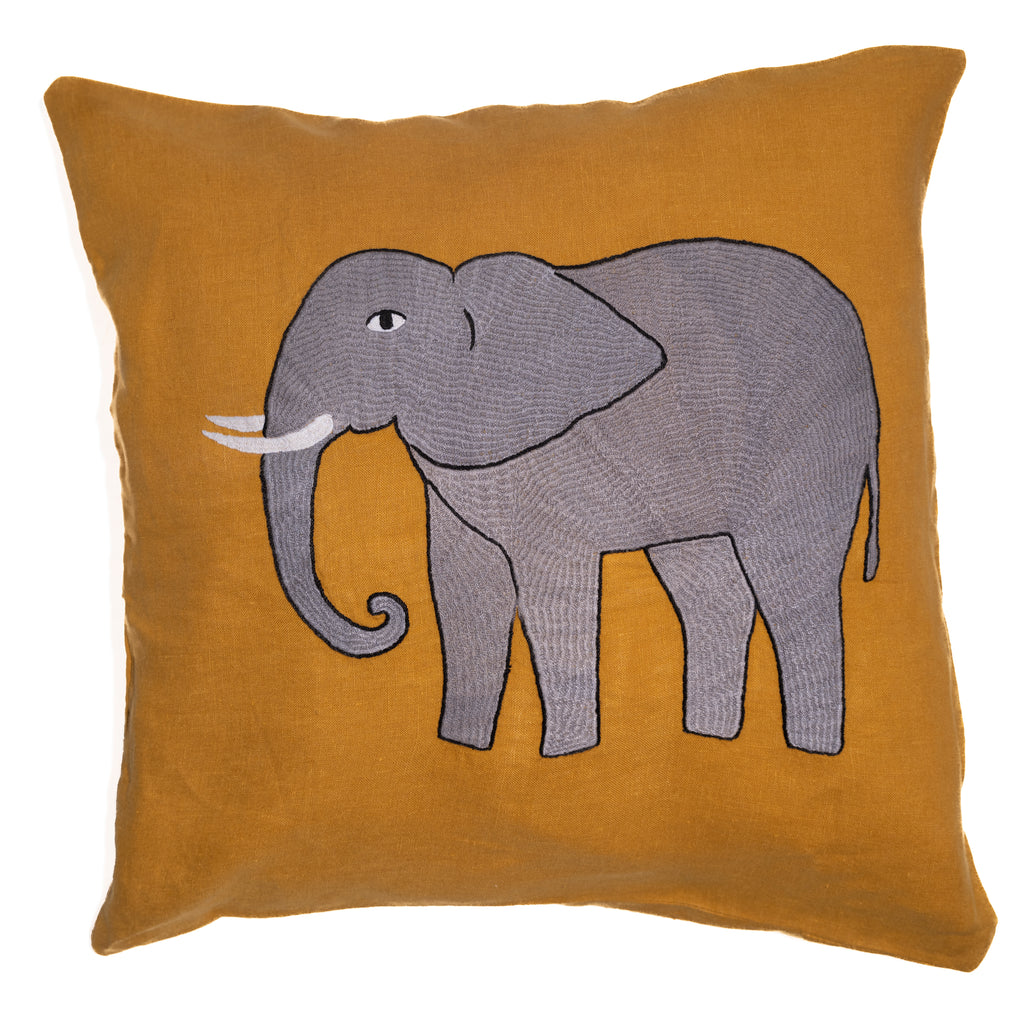 Elephant pillow on yellow linen