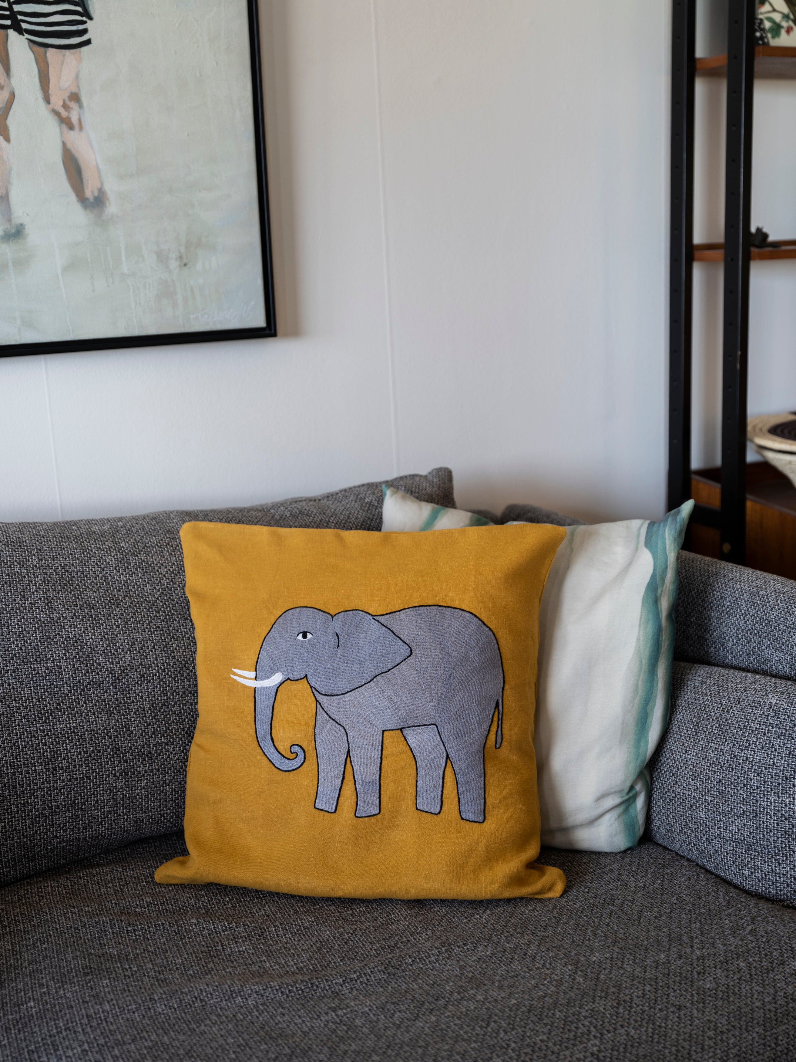 Elephant pillow on yellow linen