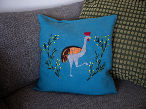 Crane pillow on blue linen