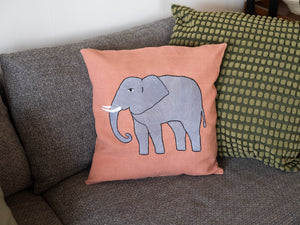 Elephant pillow on pink linen