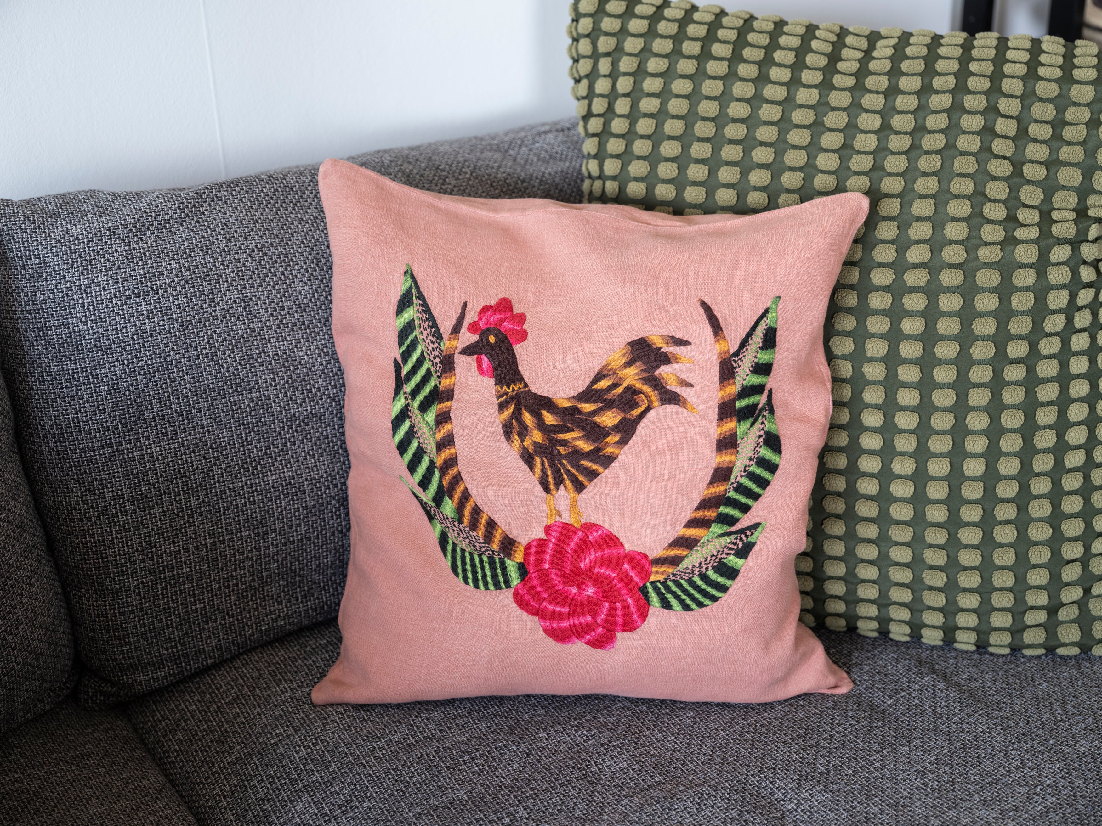 Chicken pillow on pink linen
