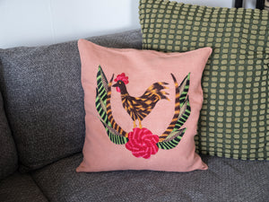 Chicken pillow on pink linen