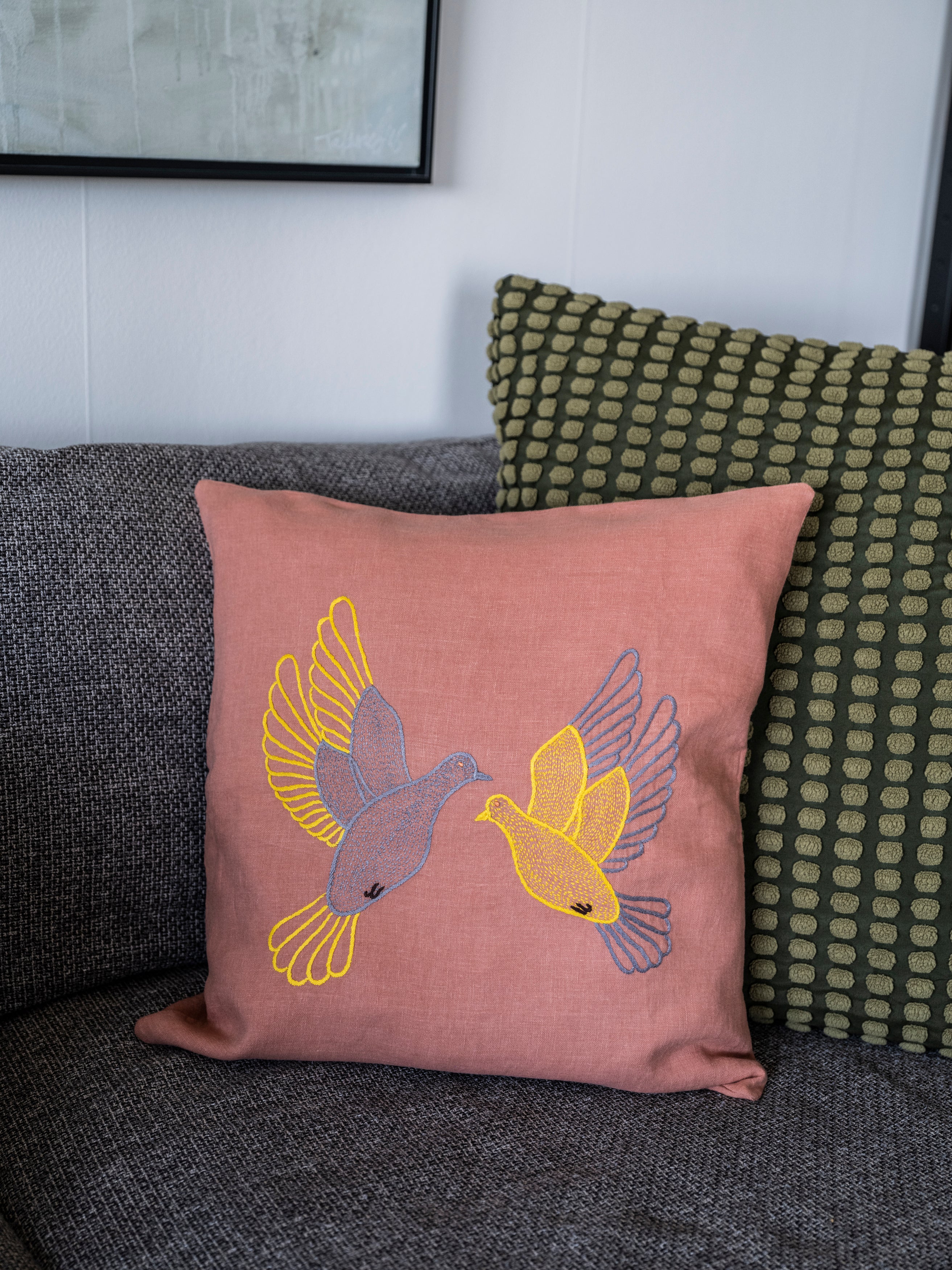 Flying dove pillow on pink linen