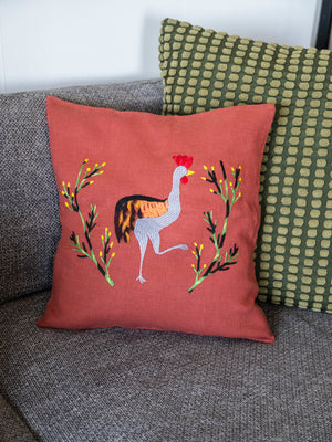 Crane pillow on red linen