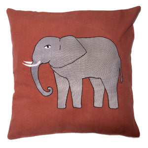 Elephant pillow on red linen
