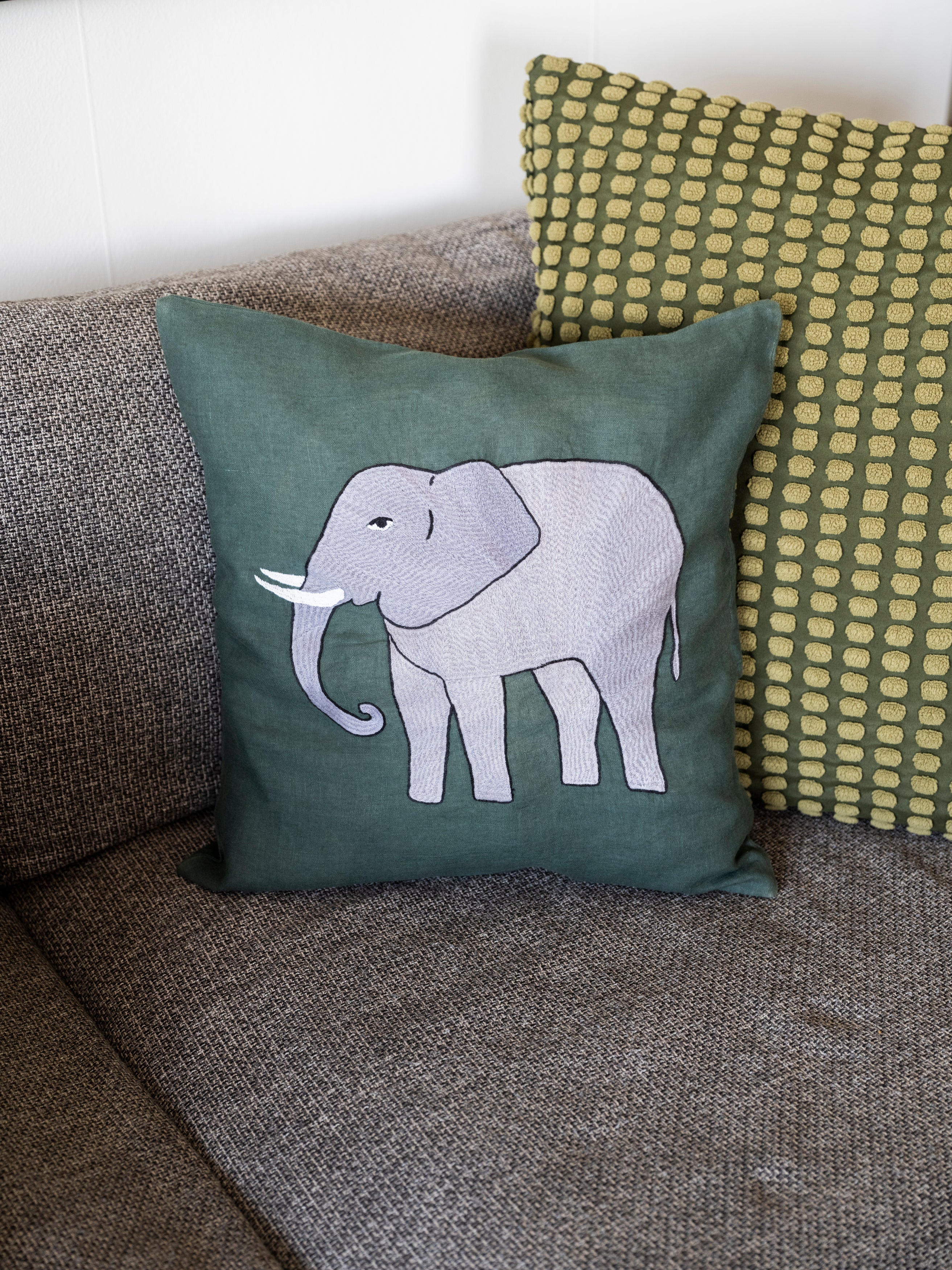 Elephant pillow on emerald linen