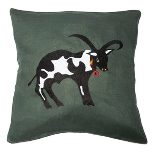 Cow pillow on emerald linen