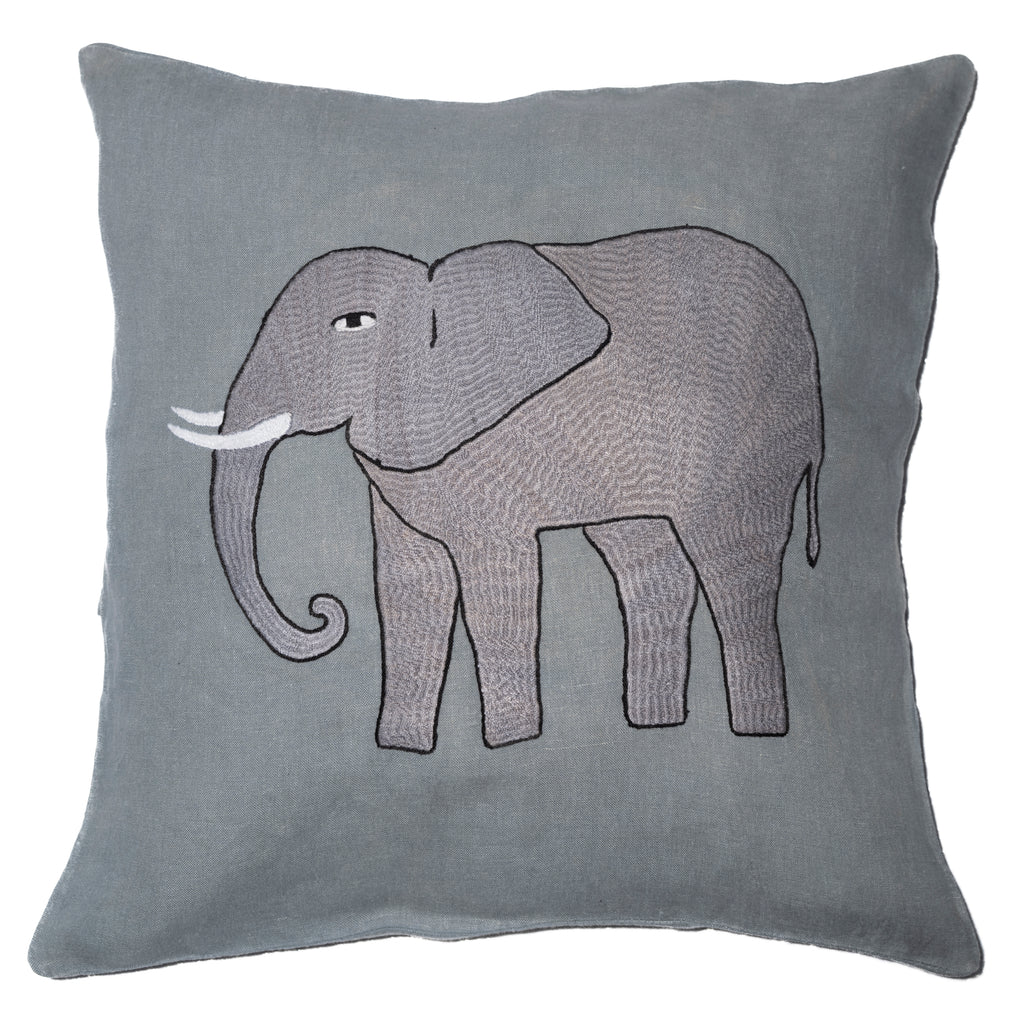 Elephant pillow on light blue linen