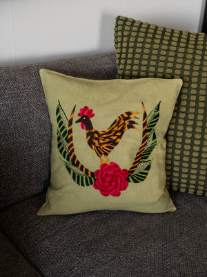 Chicken pillow on light green linen