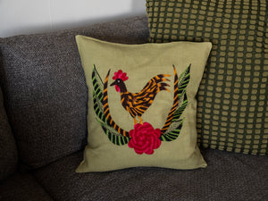 Chicken pillow on light green linen