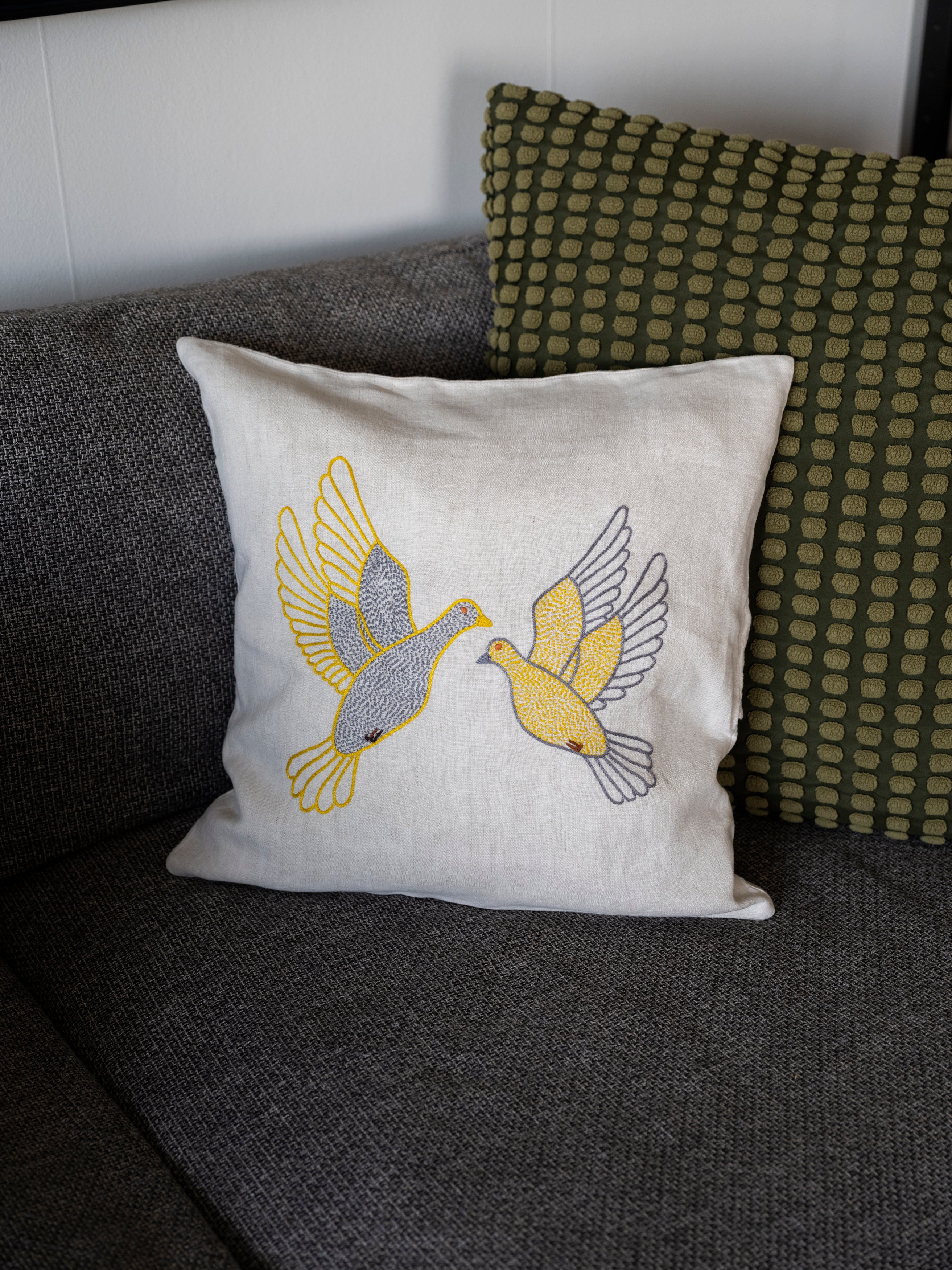 Flying dove pillow on natural linen