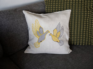 Flying dove pillow on natural linen