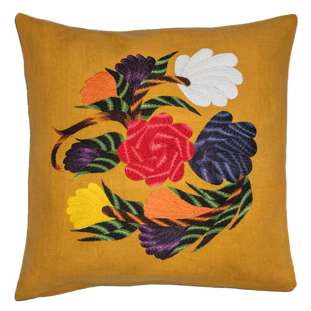 Flower pillow on yellow linen