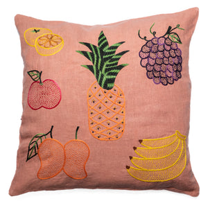 Decorative pillow with embroidered fruit designs on a pink background