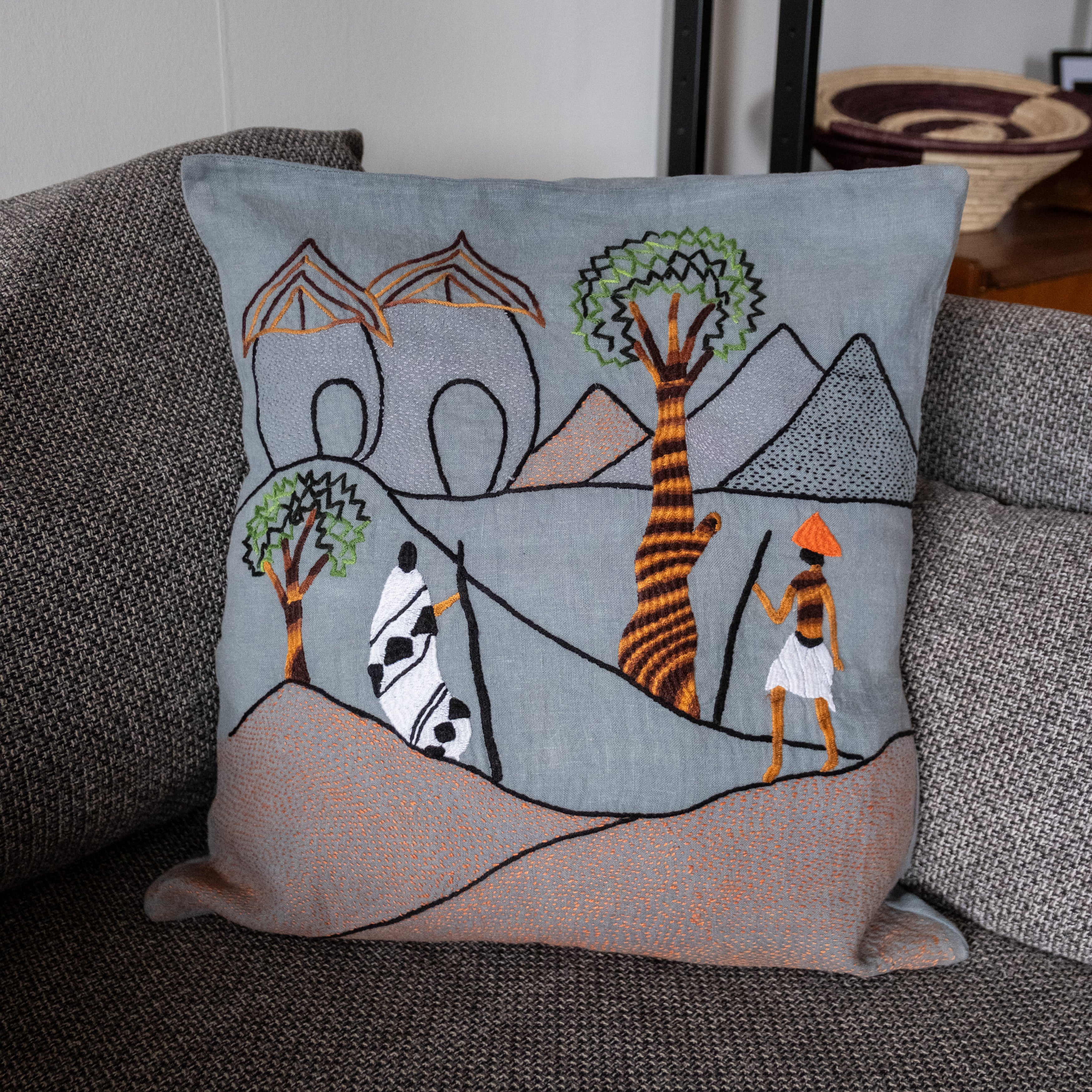 Mountain walk pillow on blue linen