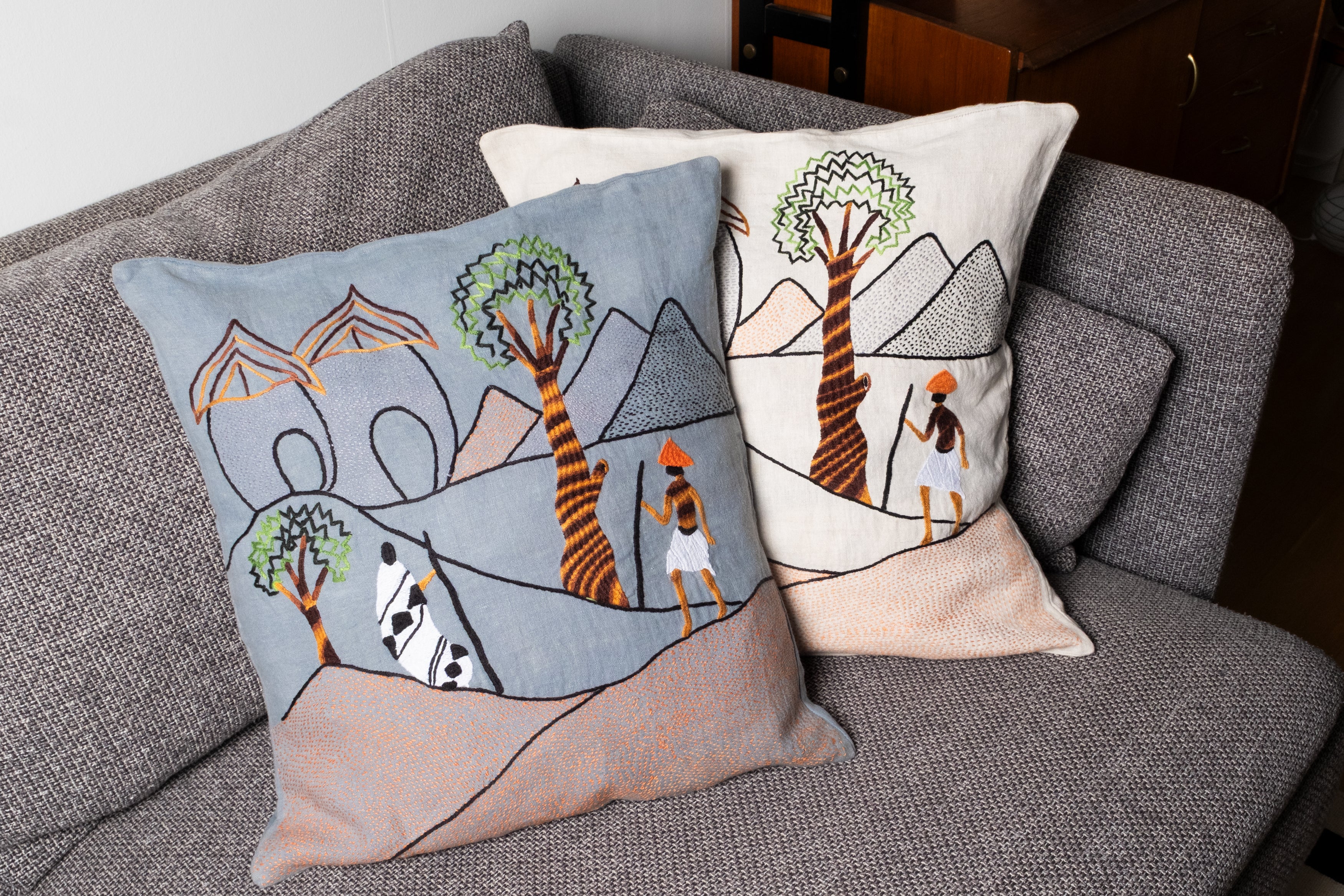 Mountain walk pillow on blue linen