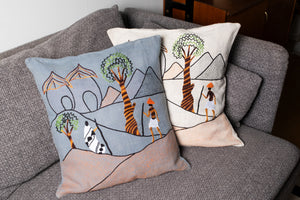 Mountain walk pillow on blue linen