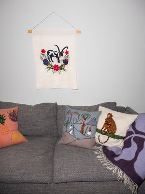 Cow wall hanging on natural linen