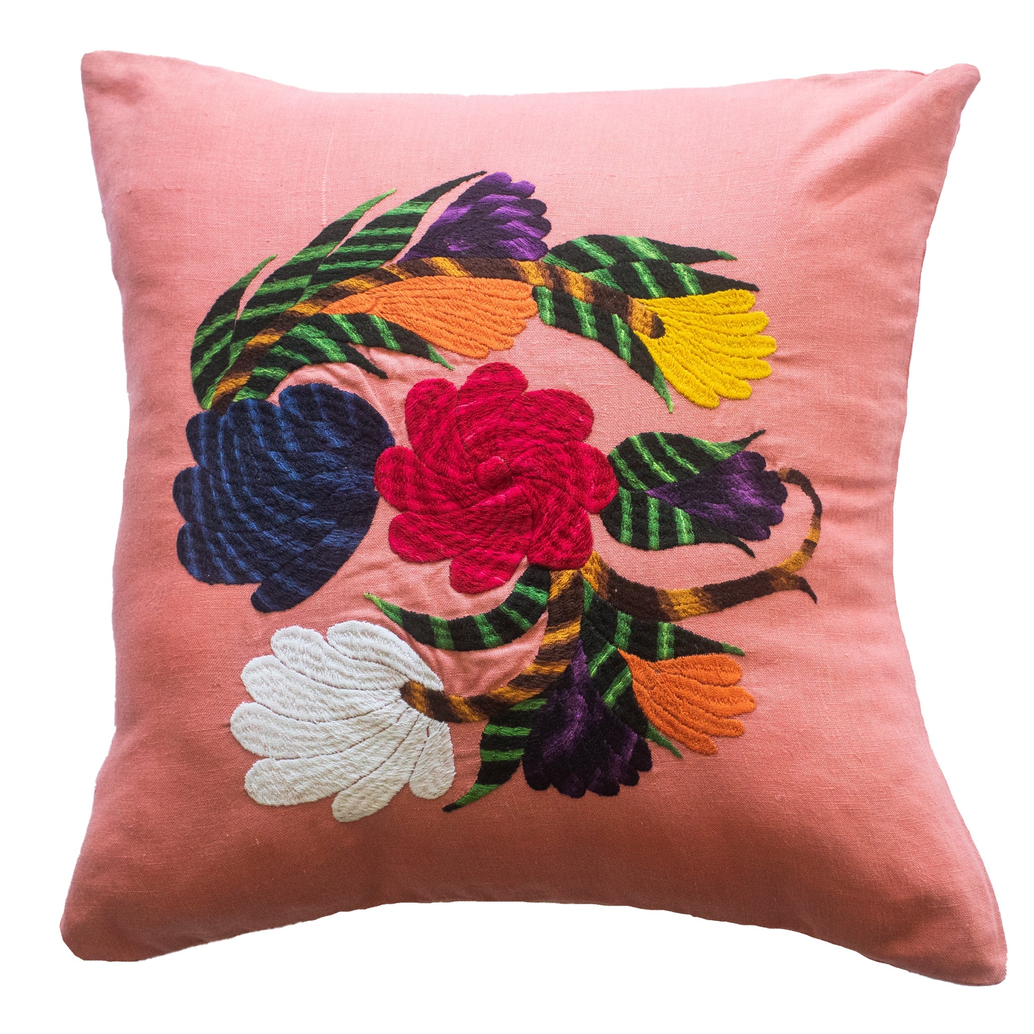Flower pillow on pink linen