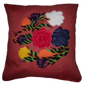 Flower pillow on red linen